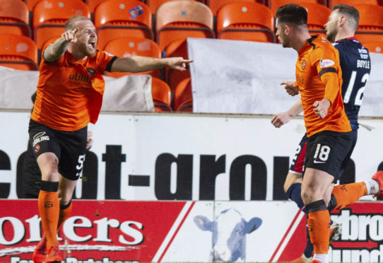 United pair Mark Connolly and scorer Calum Butcher celebrate after the winner against County last month.