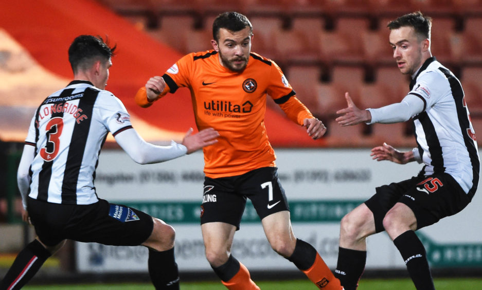 Dundee United's Paul McMullan (centre) in action with Dunfermline's Jackson Longridge (L) and Ryan Blair