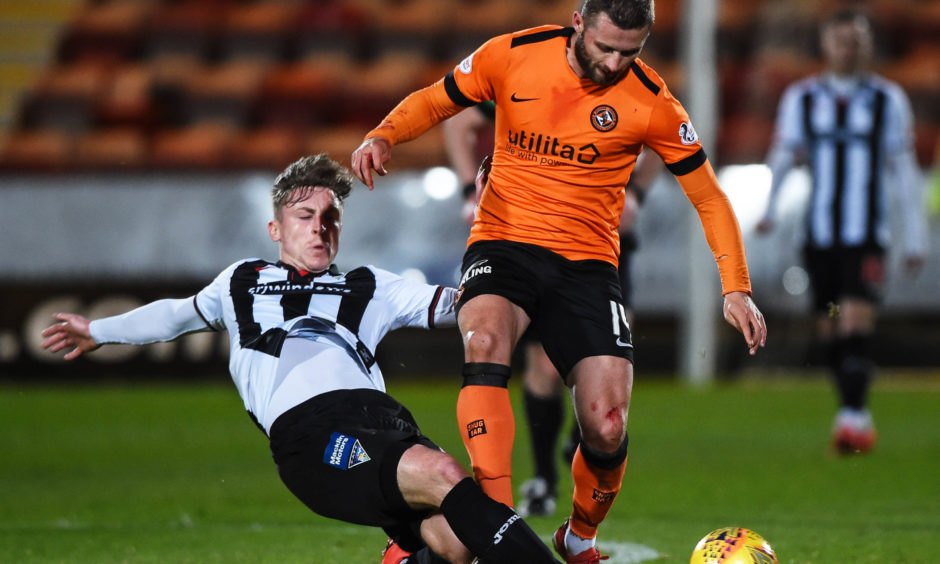 Dundee United's Pavol Safranko (R) is tackled by Dundee United's Lee Ashcroft