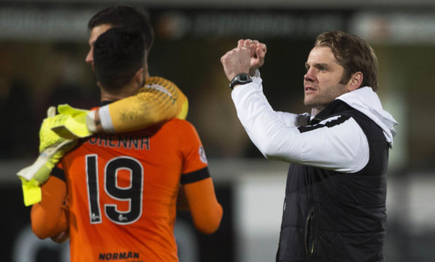 Robbie Neilson, right, celebrates at the final whistle.