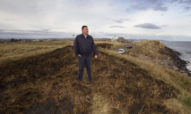Mark Salmond at the grass area burnt along the seafront at Montrose.
