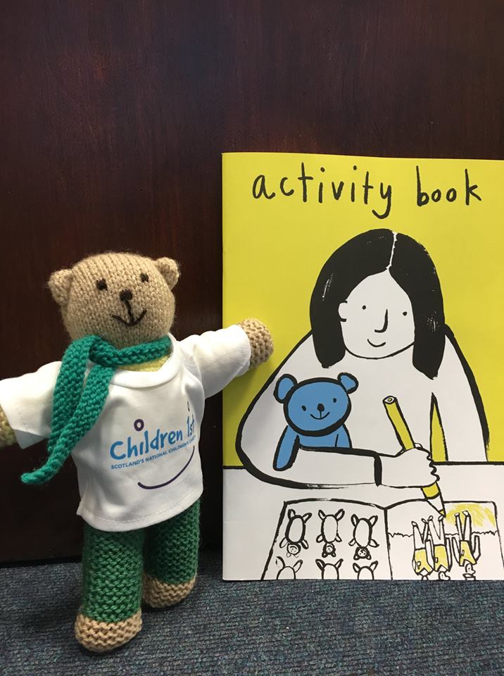An image showing the comfort teddy and activity book.