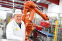 Robert Chapman of Farmlay Eggs with the robots at the firm’s plant in Strichen.
