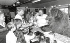 Hercules in Dundee's Powrie Bar in 1988, with owner Andy Robins and bar owner Tom Lees.