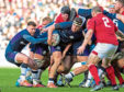 Scotland's Ali Price (L) takes the ball form the back of the maul against Wales.