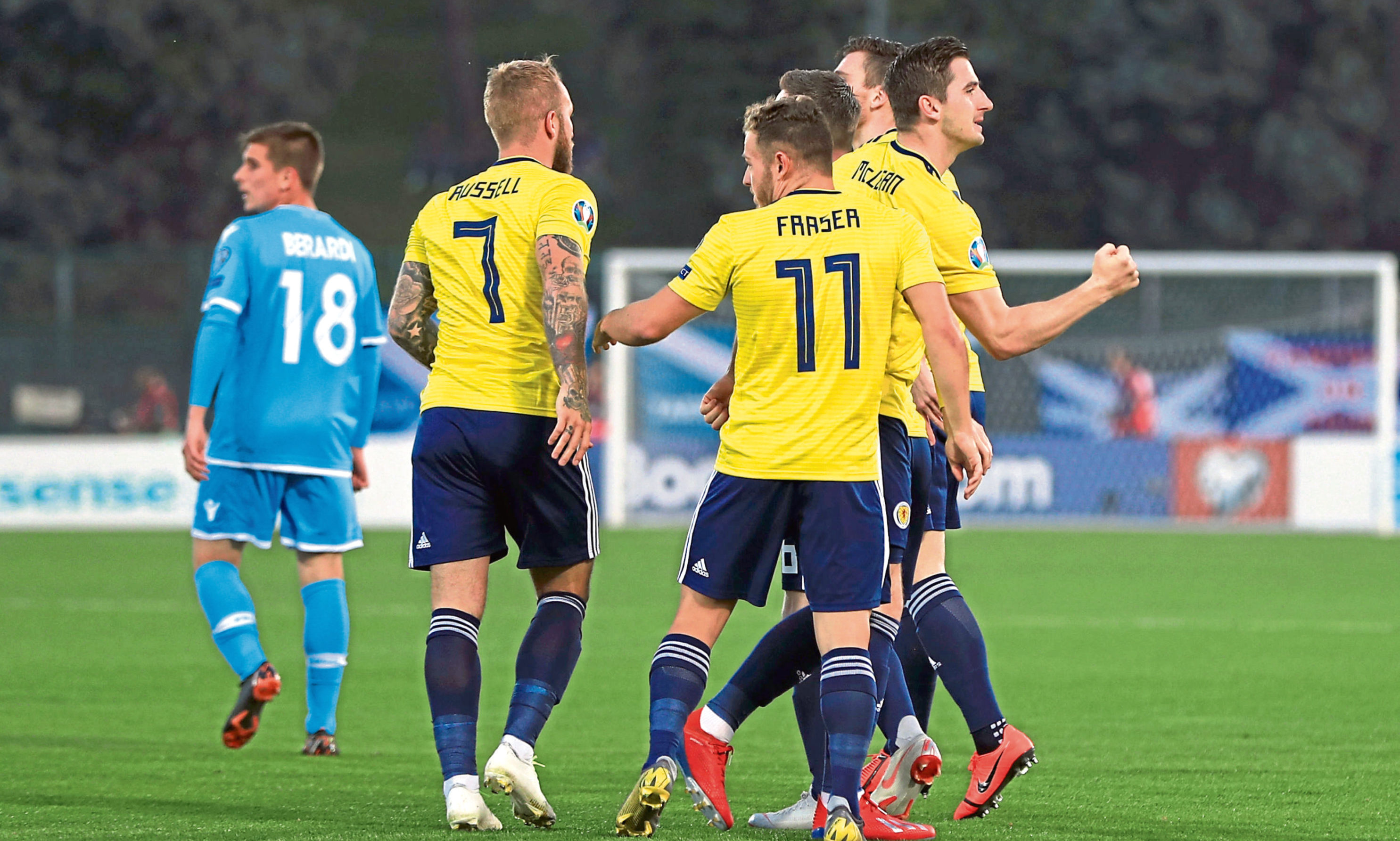 Scotland's Kenny McLean (far right) celebrates scoring his side's first goal of the game with team-mates during the UEFA Euro 2020 Qualifying, Group I match at the San Marino Stadium, Serravalle.
