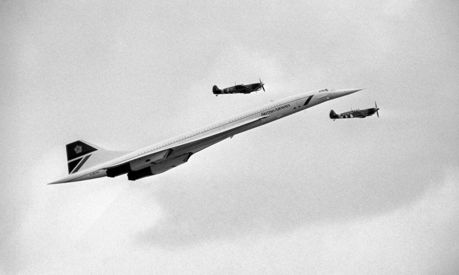 A British Airways Concorde shadowed by two Second World War Spitfires as it arrives to make passes over the Biggin Hill Air Show in 1986.