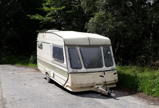 Tents, chopped down fences and even abandoned caravans have been left at Loch Tummel by wild campers