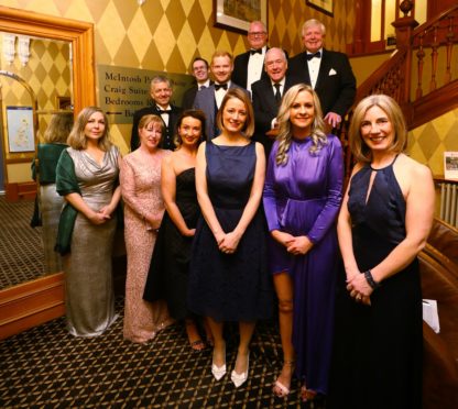 The organising committee and guest speaker Andy Cameron (in front of Ian Philip).