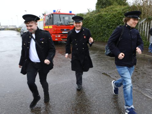 Connor McDade, Alan Duncan and Levon Anderson, who were raising money for Dundee Junior Showtime, with the 1995 Dennis fire engine, in Laurencekirk