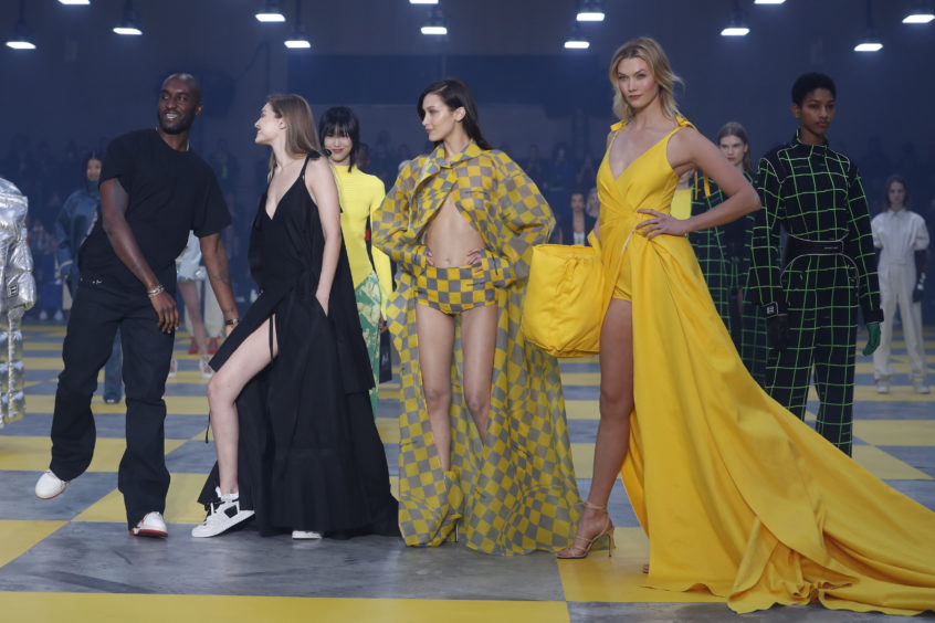 Designer Virgil Abloh, from left, poses with models Gigi Hadid, Bella Hadid and Karlie Kloss at the conclusion of the Off-White ready to wear Fall-Winter 2019-2020 collection, that was presented in Paris.