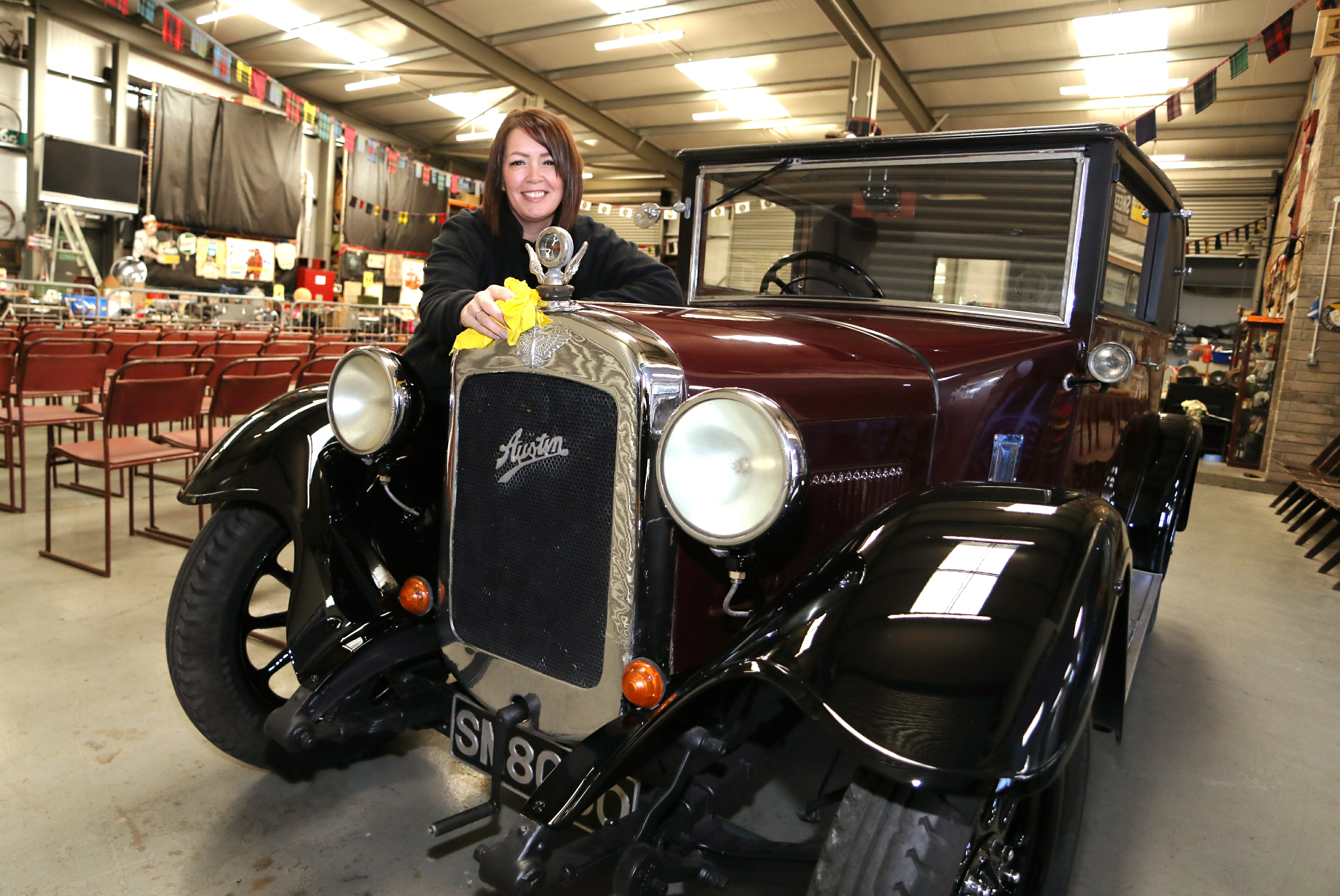 SVVC administrator Lesley Munro gives an 1930 Austin 12 a final polish ahead of the weekend auction