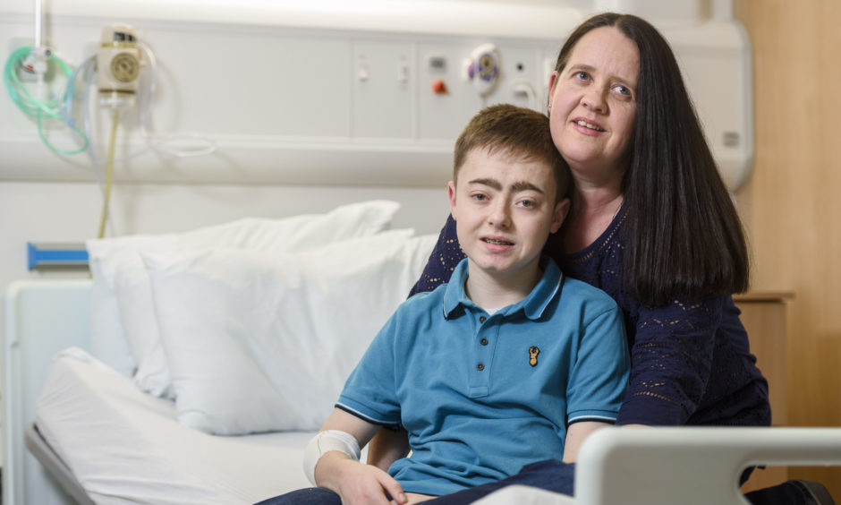 Cheryl Gallacher, 44, with her son Stephen Gallacher, 15, from Musselburgh in East Lothian, as she prepares to be a live kidney donor for her son, at the Royal Hospital for Children in Glasgow. The 15-year-old has become the 100th child in Scotland to receive a kidney transplant from a living donor. Stephen  received the organ from his mother Cheryl in a transplant operation lasting just over four hours at Glasgow's Royal Hospital for Children on Wednesday.
