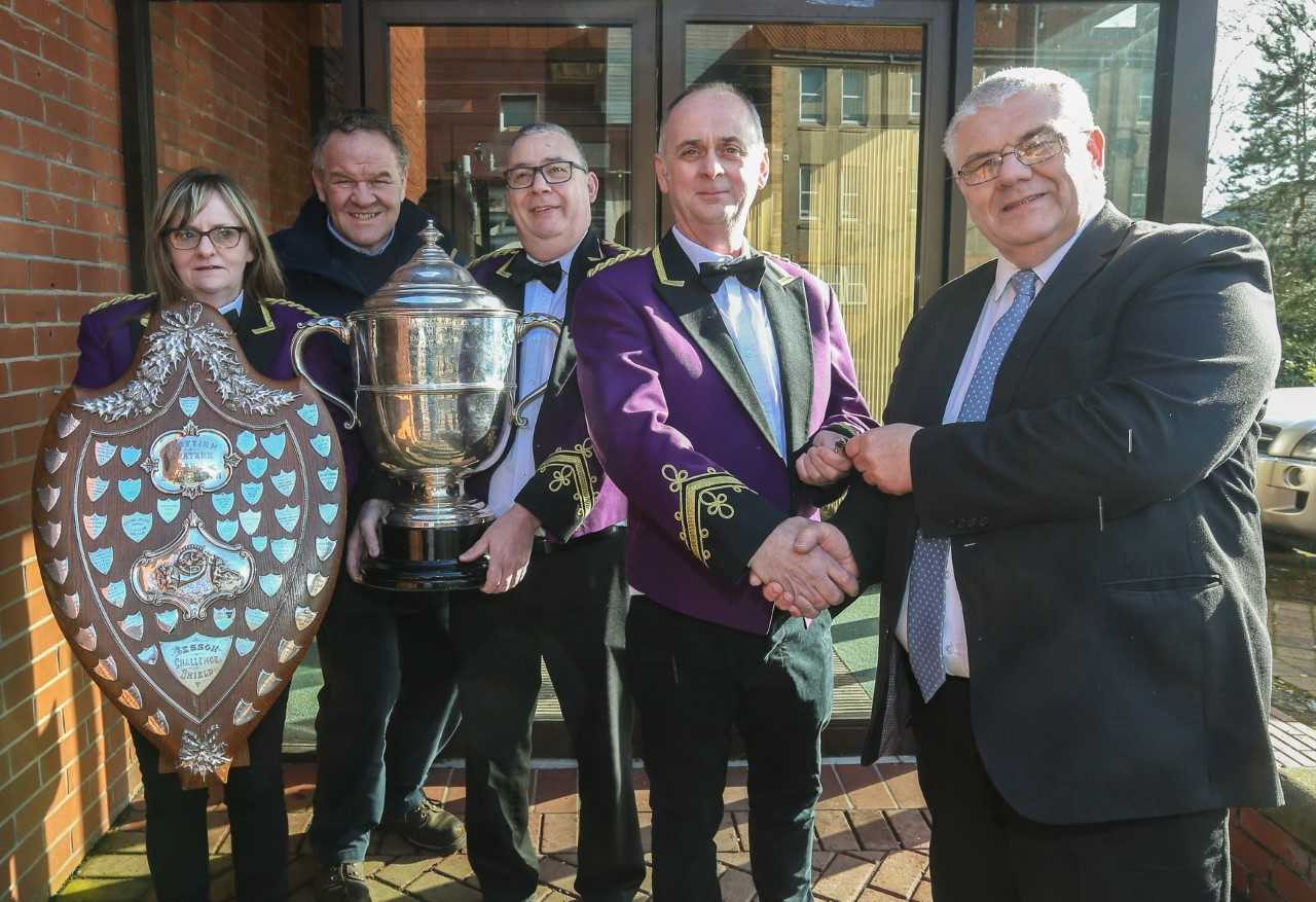 Councillor Gary Guichan hands over the keys to William Mclaughlin of Kingdom Brass, watched by Michelle McLaughlin, Councillor Alex Campbell and Paul Hamilton.