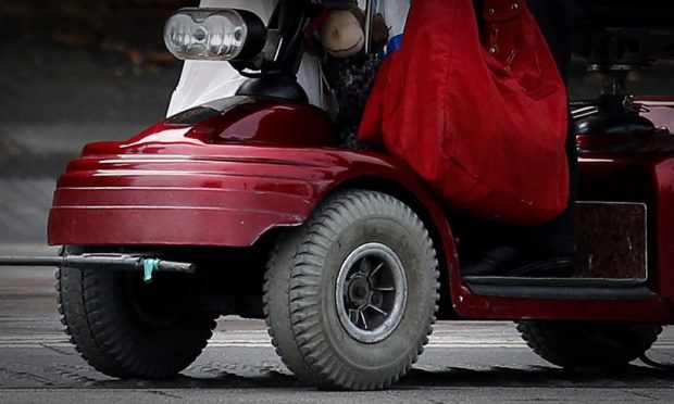 The woman became trapped under her mobility scooter. (stock image)