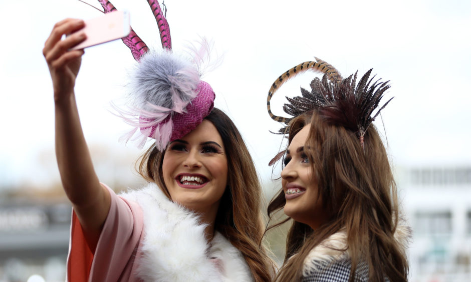 Amy Brown and Jessica Carpenter stop for a selfie. Nigel French/PA