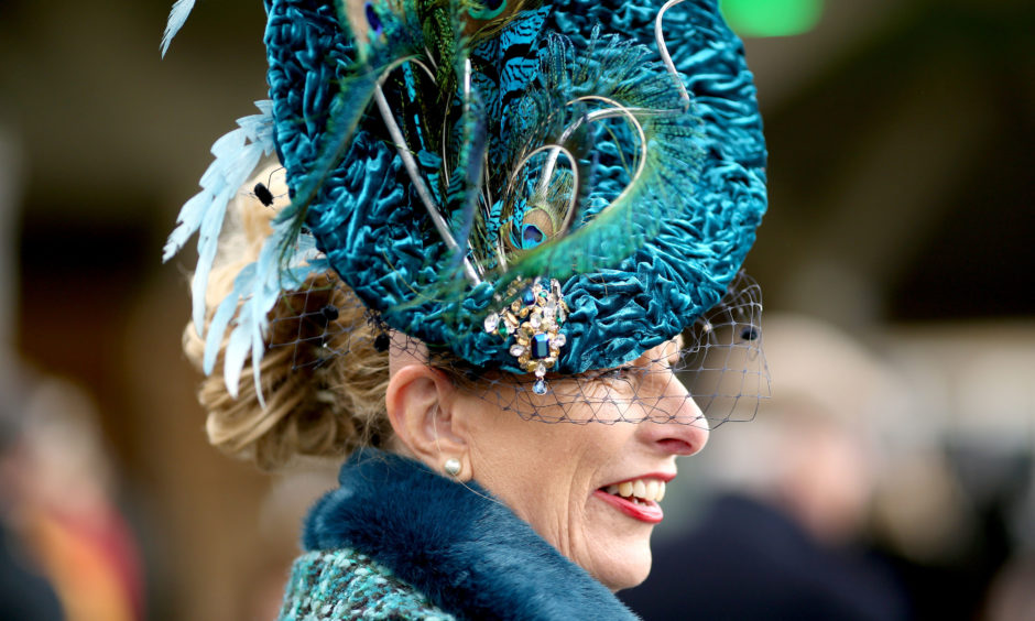 A racegoer during Ladies Day. Paul Harding/PA