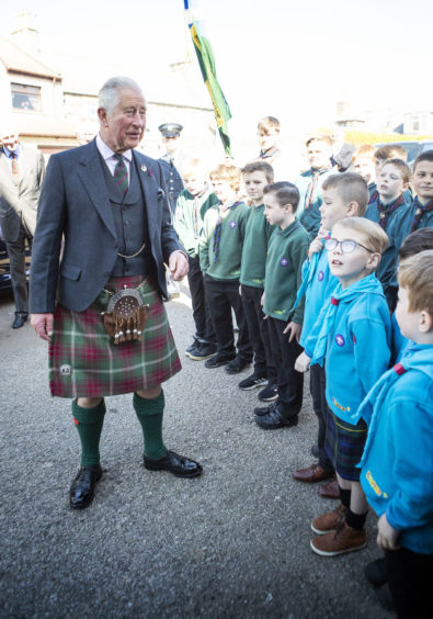 The Prince of Wales, known as the Duke of Rothesay while in Scotland, meets scouts during a visit to the newly refurbished 1st Macduff Scout Hut in Macduff, Aberdeenshire.