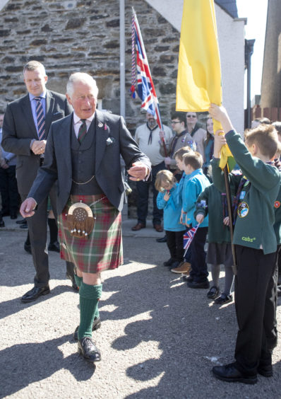 The Prince of Wales, known as the Duke of Rothesay while in Scotland, meets scouts during a visit to the newly refurbished 1st Macduff Scout Hut in Macduff, Aberdeenshire.
