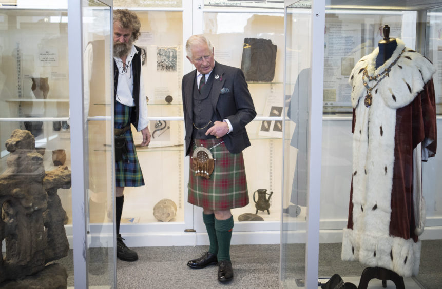 The Prince of Wales, known as the Duke of Rothesay while in Scotland, meets members of the community during a visit to the newly refurbished 1st Macduff Scout Hut in Macduff, Aberdeenshire.