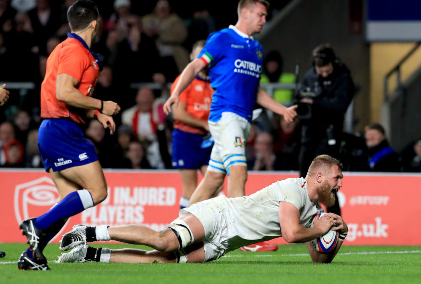 England's Brad Shields scores his team's eighth try during the Guinness Six Nations match at Twickenham Stadium, London.