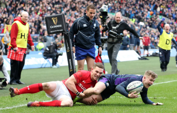 Scotland's Darcy Graham dives in to score Scotland's sole try.