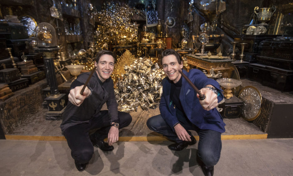 James Phelps and Oliver Phelps in front of the Lestrange Vault set at the opening of the new Gringotts Wizarding Bank expansion at the Making Of Harry Potter attraction at the Warner Bros Studio Tour, in Watford.