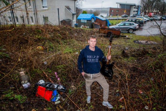 Harry Marshall with examples of the type of rubbish escaping from the landfill at Friarton Recycling Centre and fly-tipping