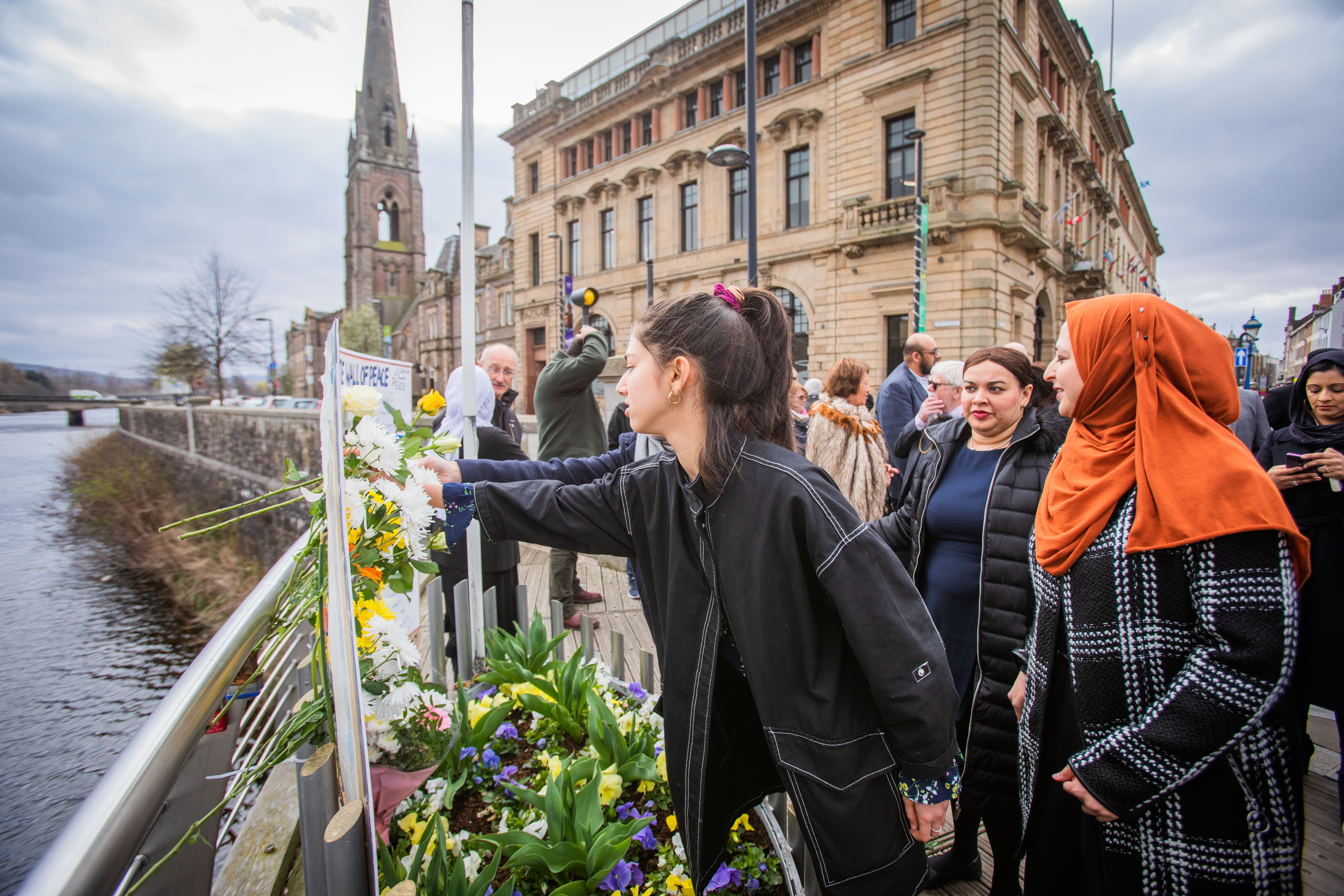 People brought flowers to pay their respects at the Peace Vigil in Perth.