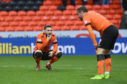 United players Nicky Clark and Paul McMullan look dejected at full-time.