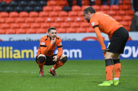 United players Nicky Clark and Paul McMullan look dejected at full-time.