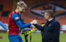 Coll Donaldson celebrates with boss John Robertson after the full-time whistle.