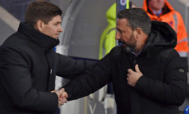 Steven Gerrard, right, shakes hands with Aberdeen boss Derek McInnes on Tuesday night.