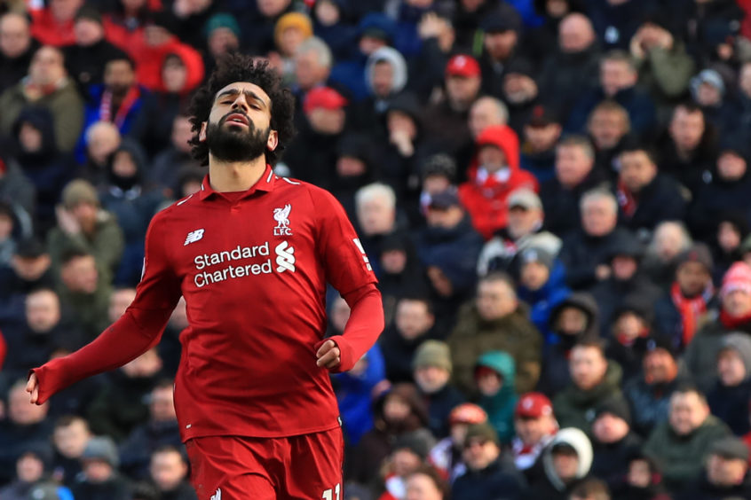 Liverpool's Mohamed Salah reacts during the Premier League match at Anfield,
