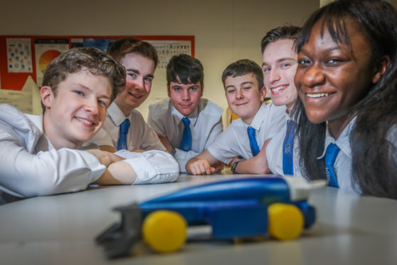 From left: Zac Brownlow, Logan Cosgrove, Matthew Begg, Ben Birtwistle, Matthew Ritchie and Emmanuella Damptey with their F1 car.