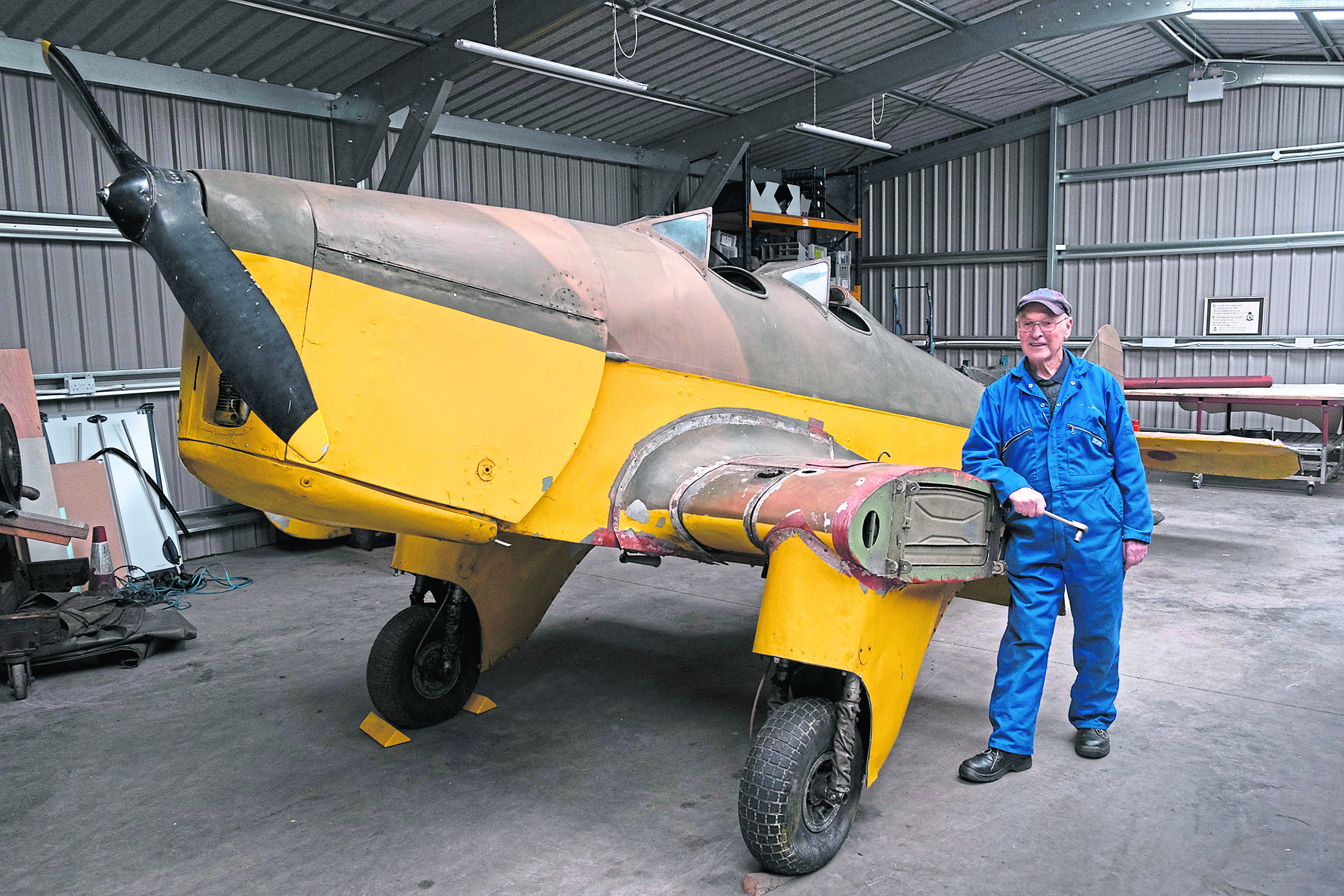 Volunteer Andy Lawrence with the plane