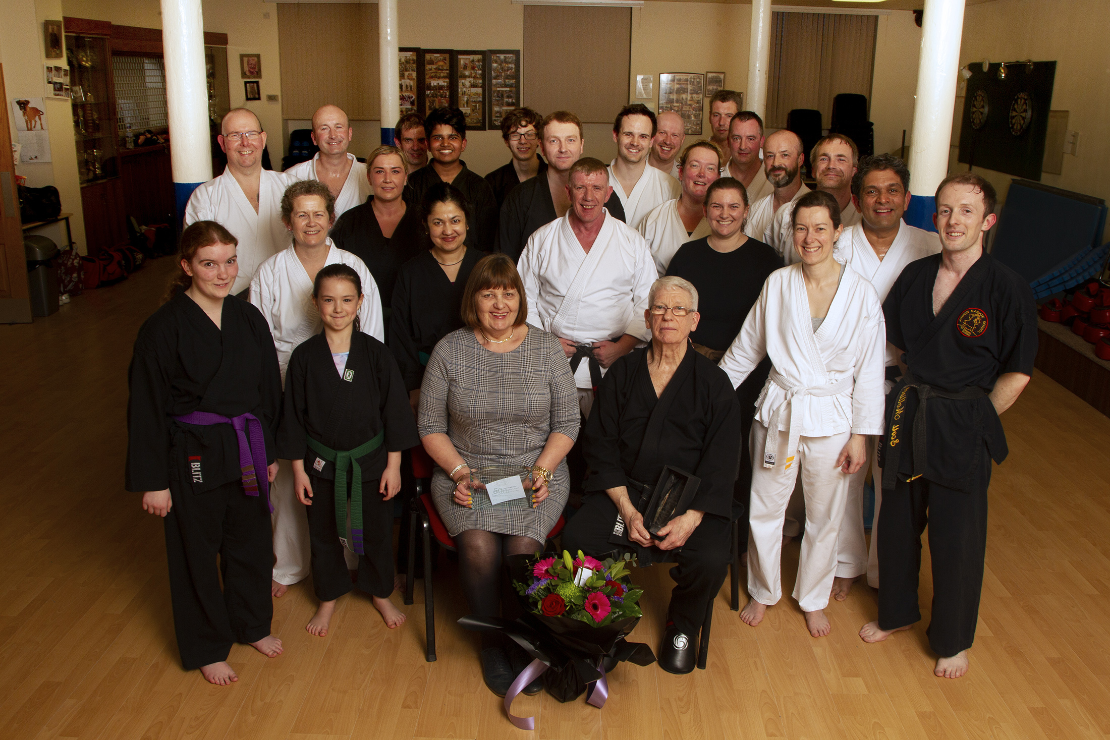 Karate black belt Jim Fraser and his wife Dorothy with Alex Sloan (centre) at the presentation