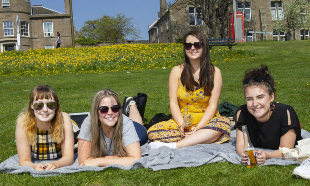 Students Emma Gilmour, Aimee Corcoran, Amy Clelland and Gaby Black out sunbathing in Dundee
Pic Paul Reid