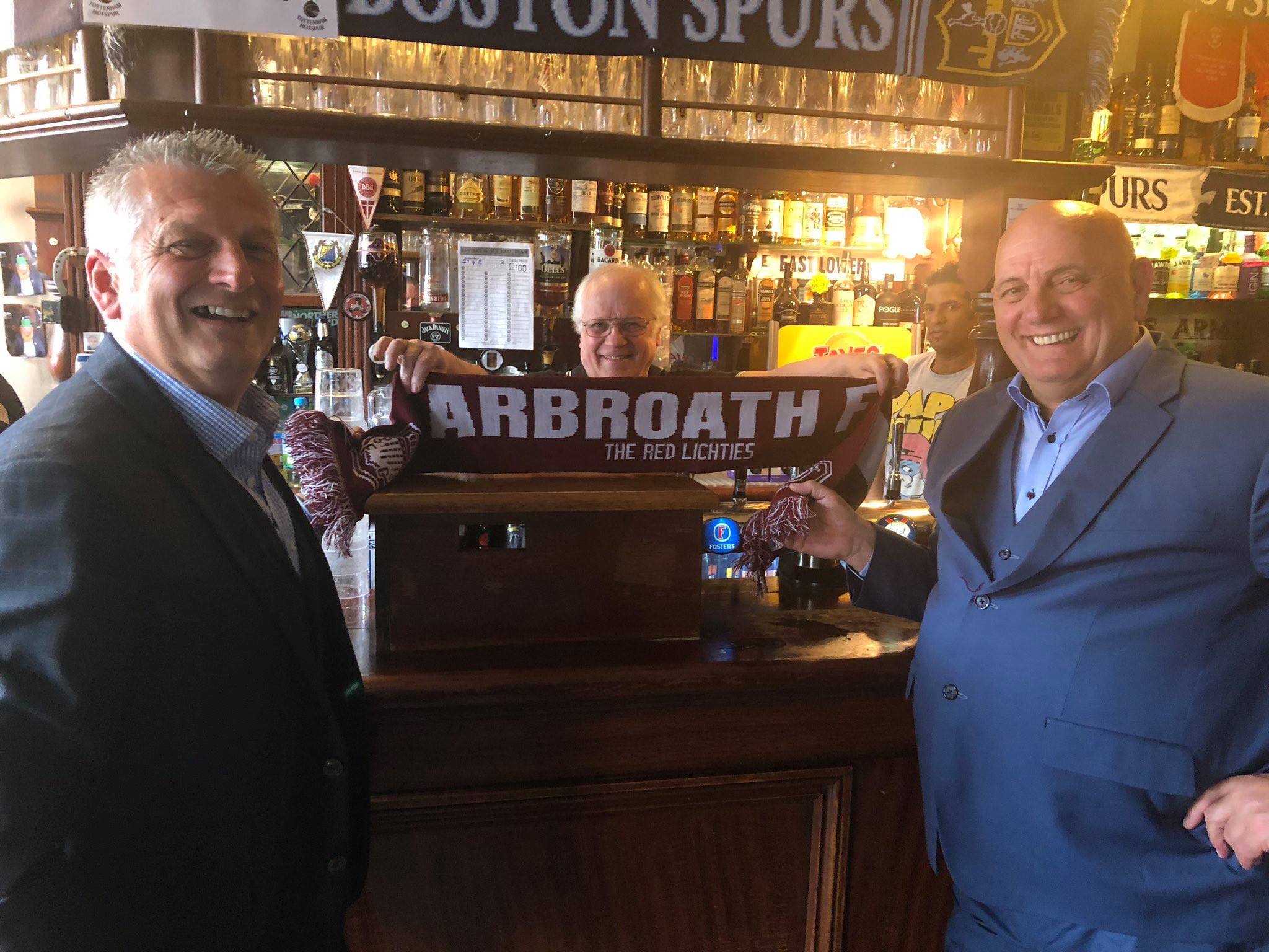 Mike, left, and Dick, right, nail their colours to the mast in the stadium bar before the match