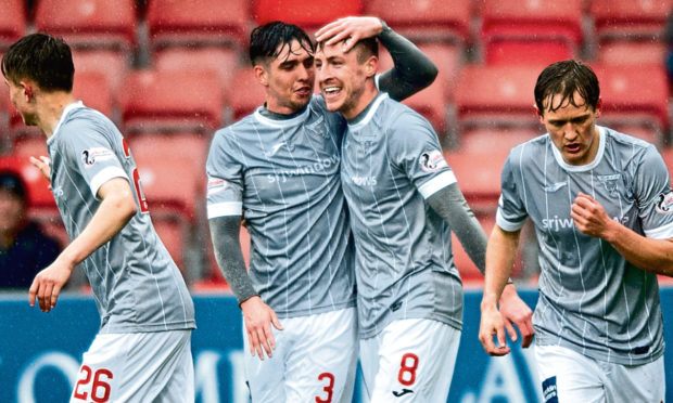 Dunfermline's Tom Beadling celebrates the opening goal with Jackson Longridge.