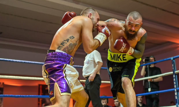 Mike Towell (right) died in hospital after collapsing in the fight against, Dale Evans (left).