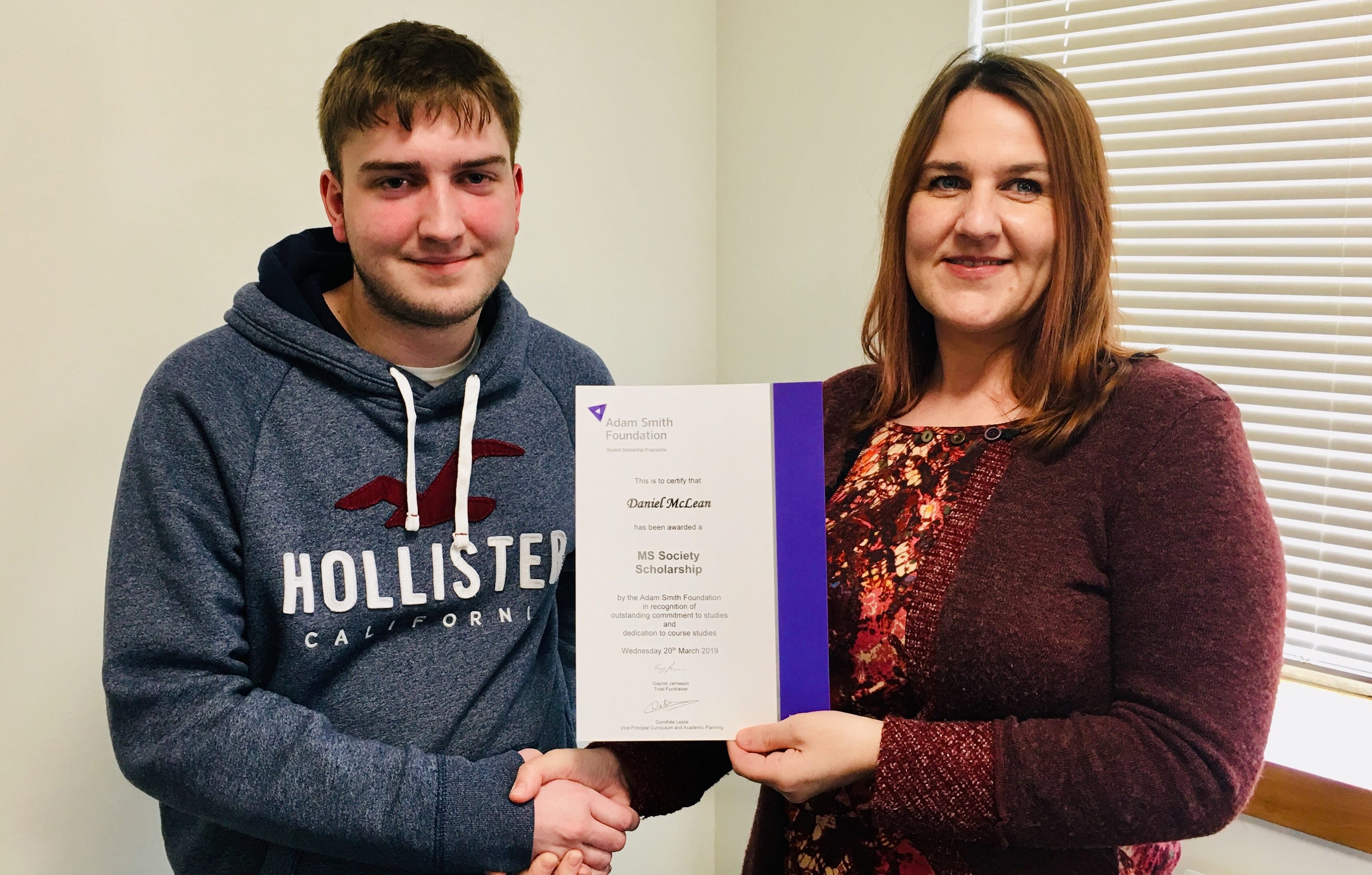 Daniel receives his scholarship from Amy Newton, branch co-ordinator for the MS Society in Scotland