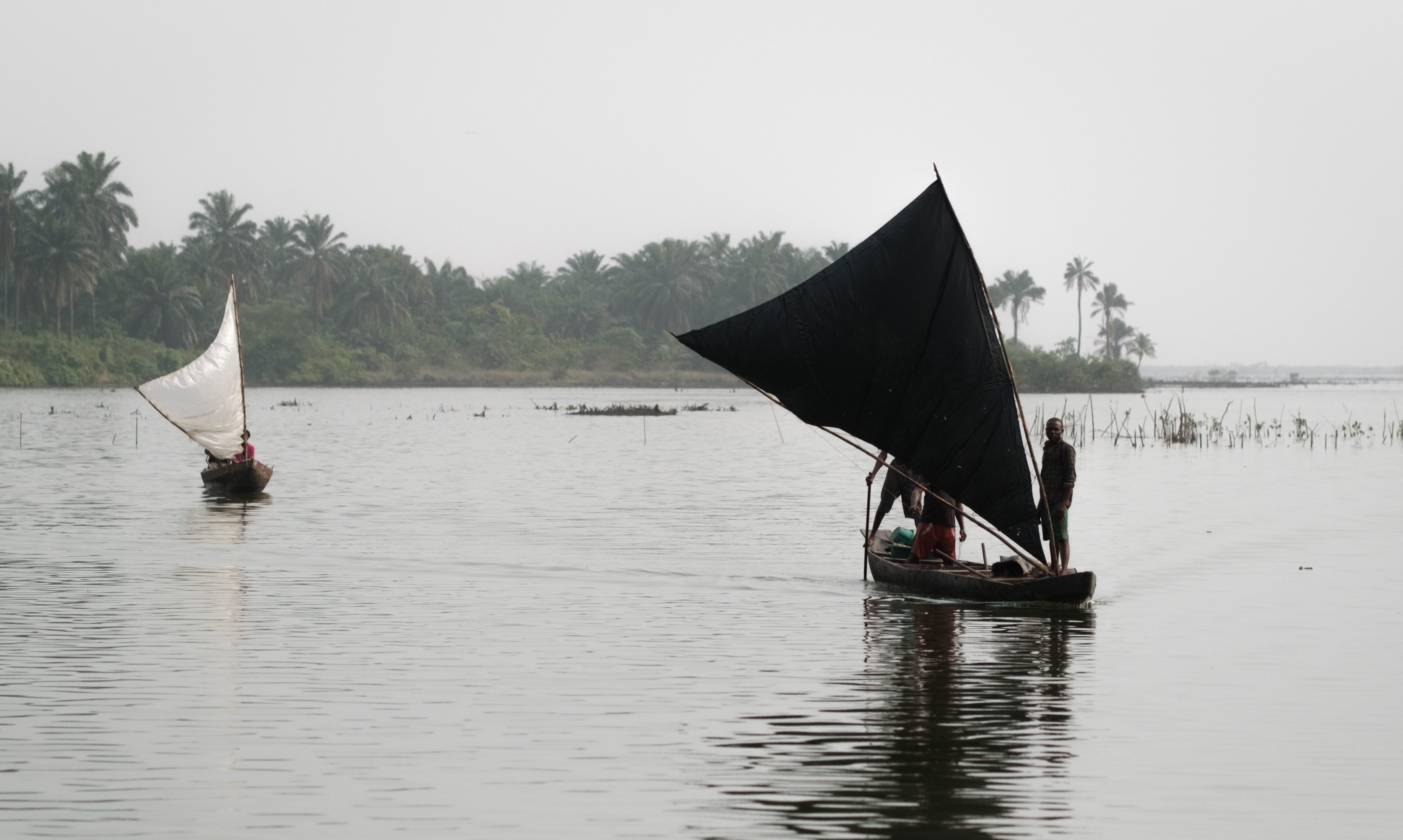 Fishermen on a river in the Niger Delta region, Nigeria.
