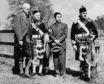 Akihito In Scotland. Crown Prince (later Emperor) of Japan, Akihito (second from right) during a visit to Blair Castle, Perthshire, Scotland, 9th May 1953. With him are James Stewart-Murray, 9th Duke of Atholl 1879 - 1957, far left), Pipe Major Peter Wilkie and piper Archibald Alves.