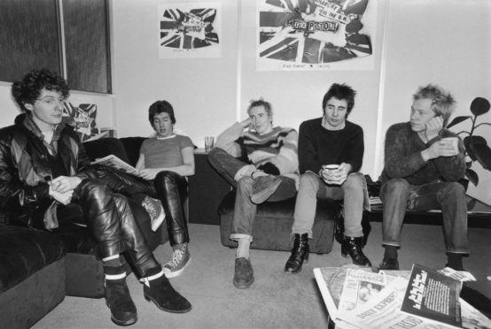 Notorious British punk rock band The Sex Pistols at the EMI studios, 2nd December 1976.  From left to right, manager Malcolm McLaren, Steve Jones, Johnny Rotten (John Lydon), Glen Matlock and Paul Cook.