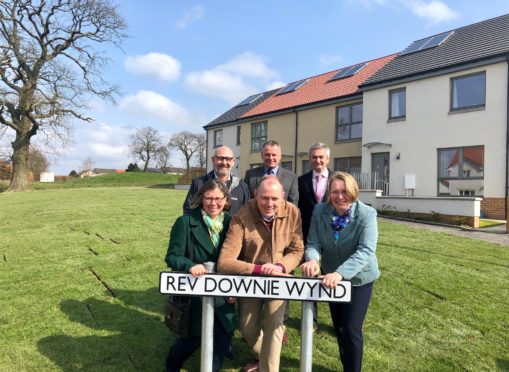 Front row: the Rev Downie’s children Margaret Gordon, Dr Alexander Downie and Allison MacNeill. Back row: Bill Banks (Kingdom), Dougie Herd (Campion Homes) and Moray Royles (City Architecture)