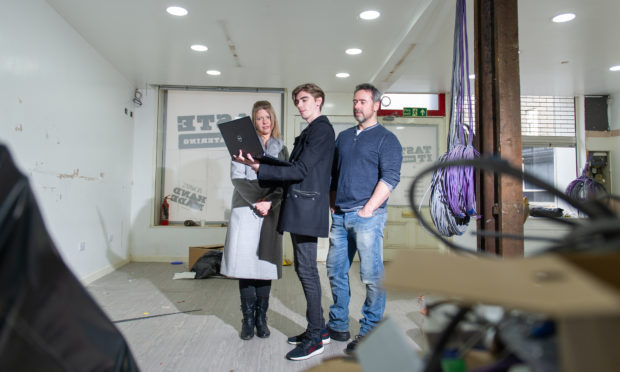 Ashley Donaldson, Drew Douglas and Gavin Innes in the retail unit which is being transformed into a computer games hub.