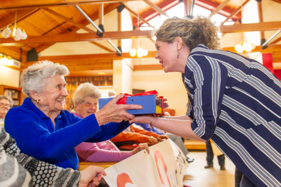 left to right - Ida Anderson chats to Councillor Lois Speed before presenting her with the petition.