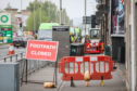 SSE dug up pavements at the junction to find and repair the fault.