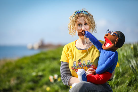 Abbey with one of her puppets in Arbroath.